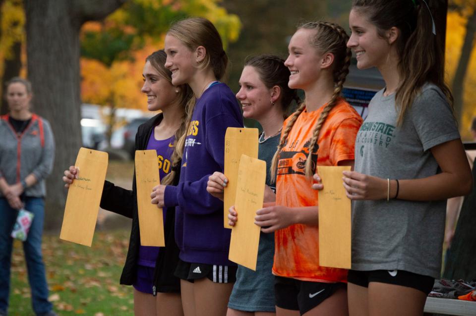 Hillsdale junior Chloe Stalhood (middle) qualifies for the LP D3 state finals after taking ninth overall.