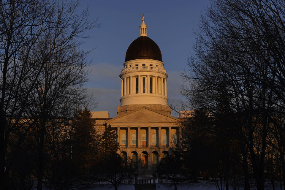 FILE - The Maine State House is seen at sunrise, March 16, 2023, in Augusta, Maine. Honoring victims, survivors and first responders following the deadliest mass shooting in Maine history is the first order of business for lawmakers returning to work Wednesday, Jan. 3, 2024, at the state House. (AP Photo/Robert F. Bukaty, File)