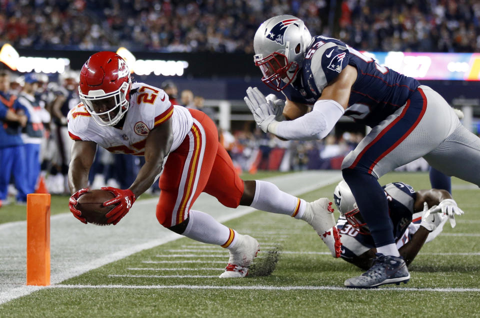 Kareem Hunt rushes for one of his three total touchdowns on Thursday. (AP) 