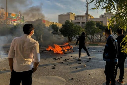 Iranian protesters block a road during a demonstration against an increase in gasoline prices in the central city of Shiraz on November 16, 2019