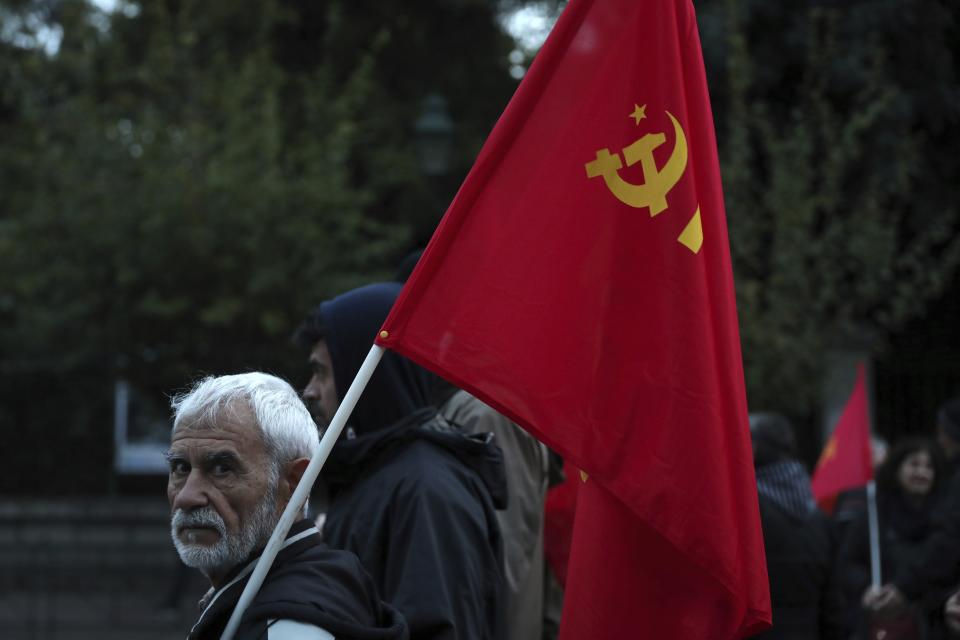 A protester takes part in a rally in Athens, Saturday, Nov. 17, 2018. Several thousands people march to the U.S. Embassy in Athens under tight police security to commemorate a 1973 student uprising that was crushed by Greece's military junta, that ruled the country from 1967-74. (AP Photo/Yorgos Karahalis)