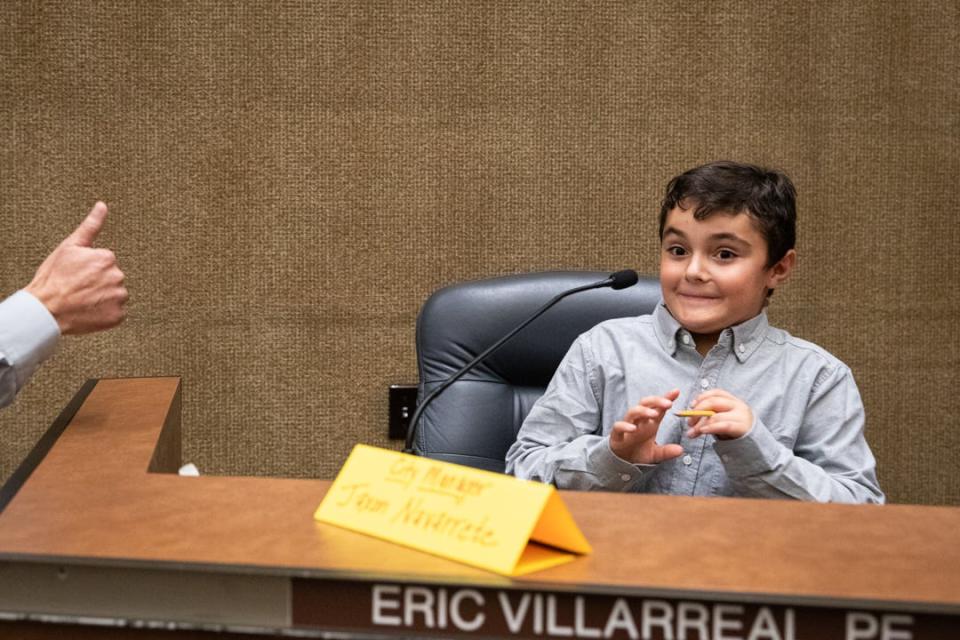 Windsor Park third grade student Jaxon Navarrete, pre-appointed as the mock city manager, reacts to a microphone test before a debate on community gardens on Tuesday, Oct. 24, 2023, in Corpus Christi, Texas.