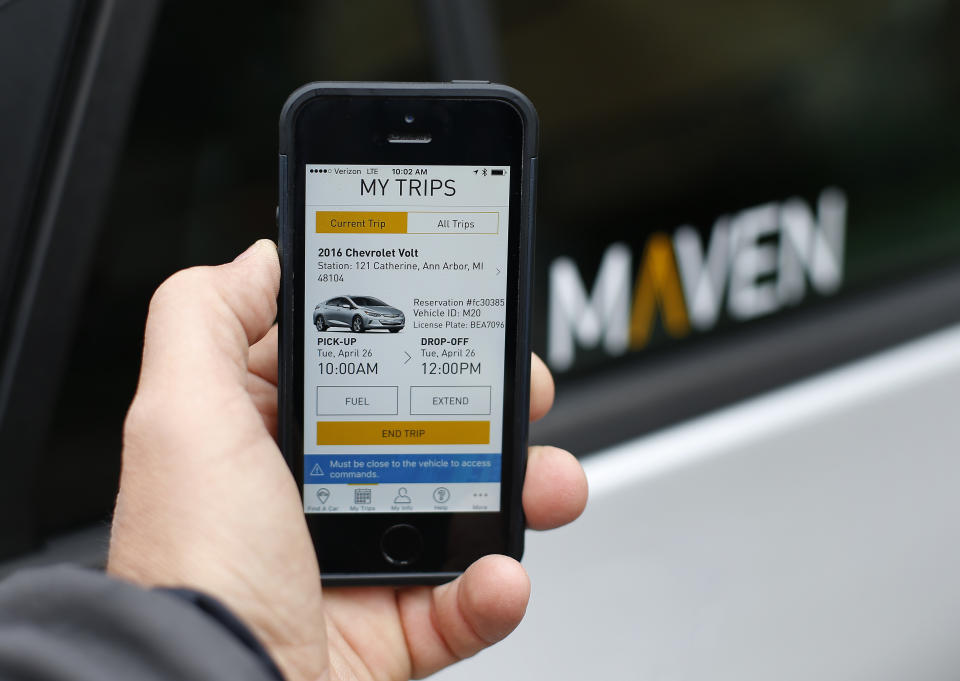 A smartphone displaying the Maven app, a General Motors car-sharing service. (AP Photo/Paul Sancya)