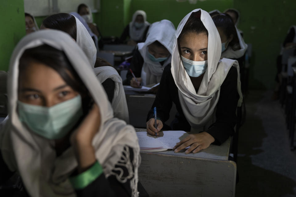 A female student listens during 10th grade class 