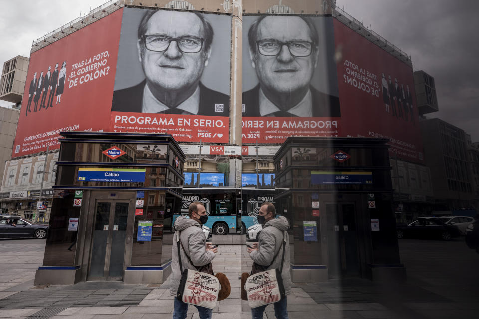 A banner of Socialist candidate for the Madrid elections Angel Gabilondo hangs on a facade building in Madrid, Spain, Monday, April 19, 2021. Residents in Madrid, one of Europe's worst-hit regions by the coronavirus pandemic, are hitting the polls on Tuesday to elect a new regional assembly in a vote resembling a plebiscite on lockdown measures. (AP Photo/Bernat Armangue)