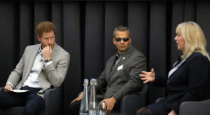 Castro, center with Prince Harry