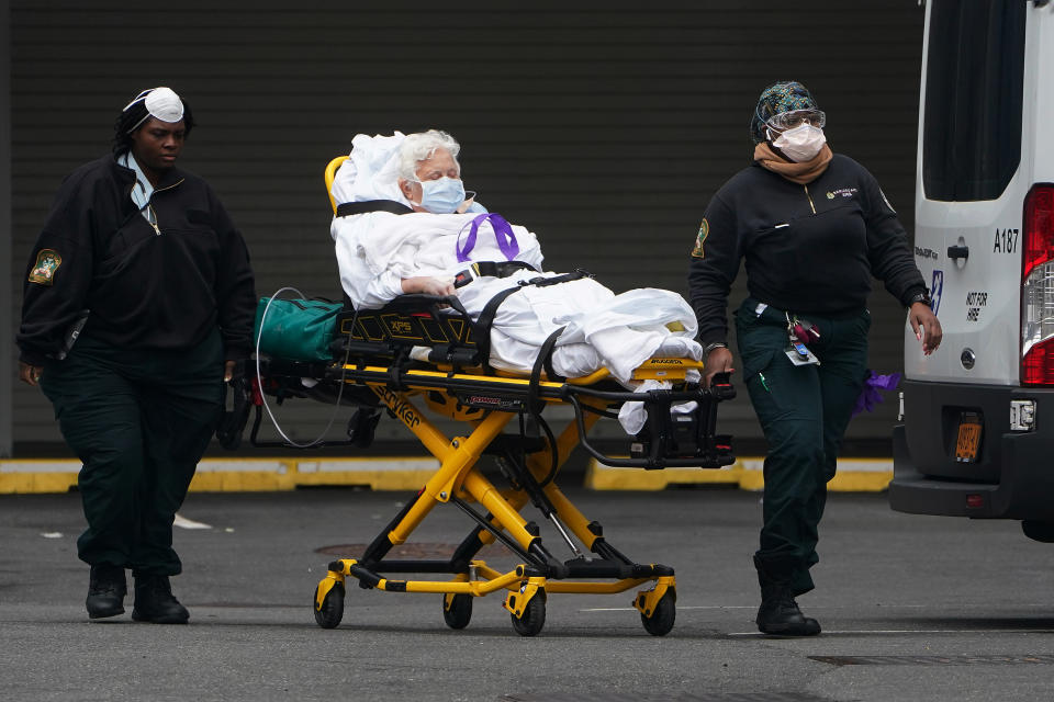 Paramedics move a patient into the hospital during the outbreak of coronavirus disease (COVID-19), in the Manhattan borough of New York City