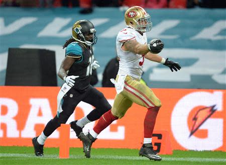 San Francisco 49ers outside linebacker Dan Skuta (51) returns a fumble for a touchdown against the Jacksonville Jaguars in the second half during an International Series game at Wembley Stadium. Mandatory Credit: Bob Martin-USA TODAY Sports