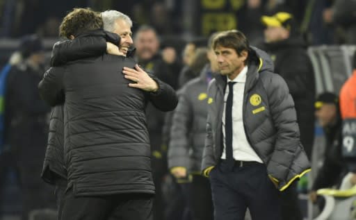 Dortmund's Swiss head coach Lucien Favre celebrates Tuesday's 3-2 victory while Inter Milan's coach Antonio Conte (R) looks on