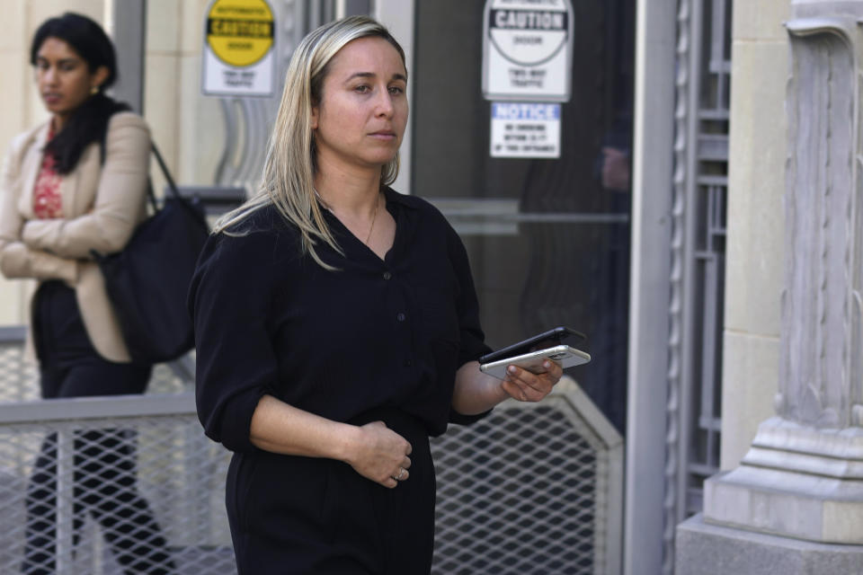 Carli Skaggs, the widow of Tyler Skaggs, walks out of a federal court building after testifying in Fort Worth, Texas, Tuesday, Feb. 15, 2022. Former Los Angeles Angels employee Eric Kay is accused of providing Tyler Skaggs the drugs that led to the pitcher's overdose death. The 27-year-old Skaggs was found dead in July 2019 in a suburban Dallas hotel room. (AP Photo/LM Otero)