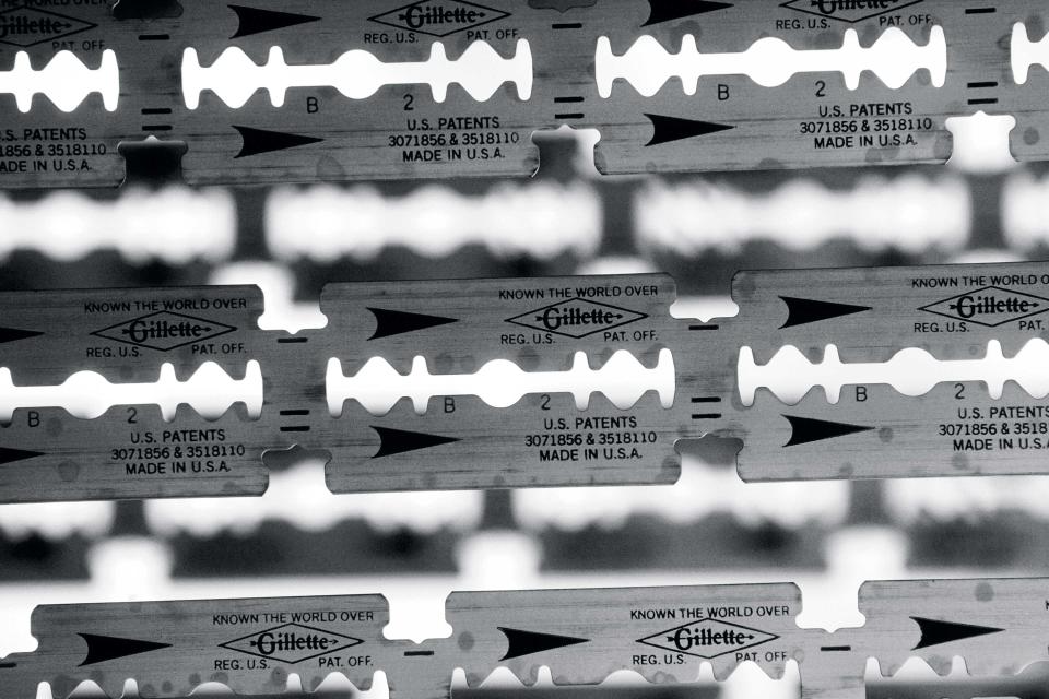 Strips of Gillette razor blades on the production line in 1936 sit ready to be coated with platinum in the Gillette factory in Rochester, New York.