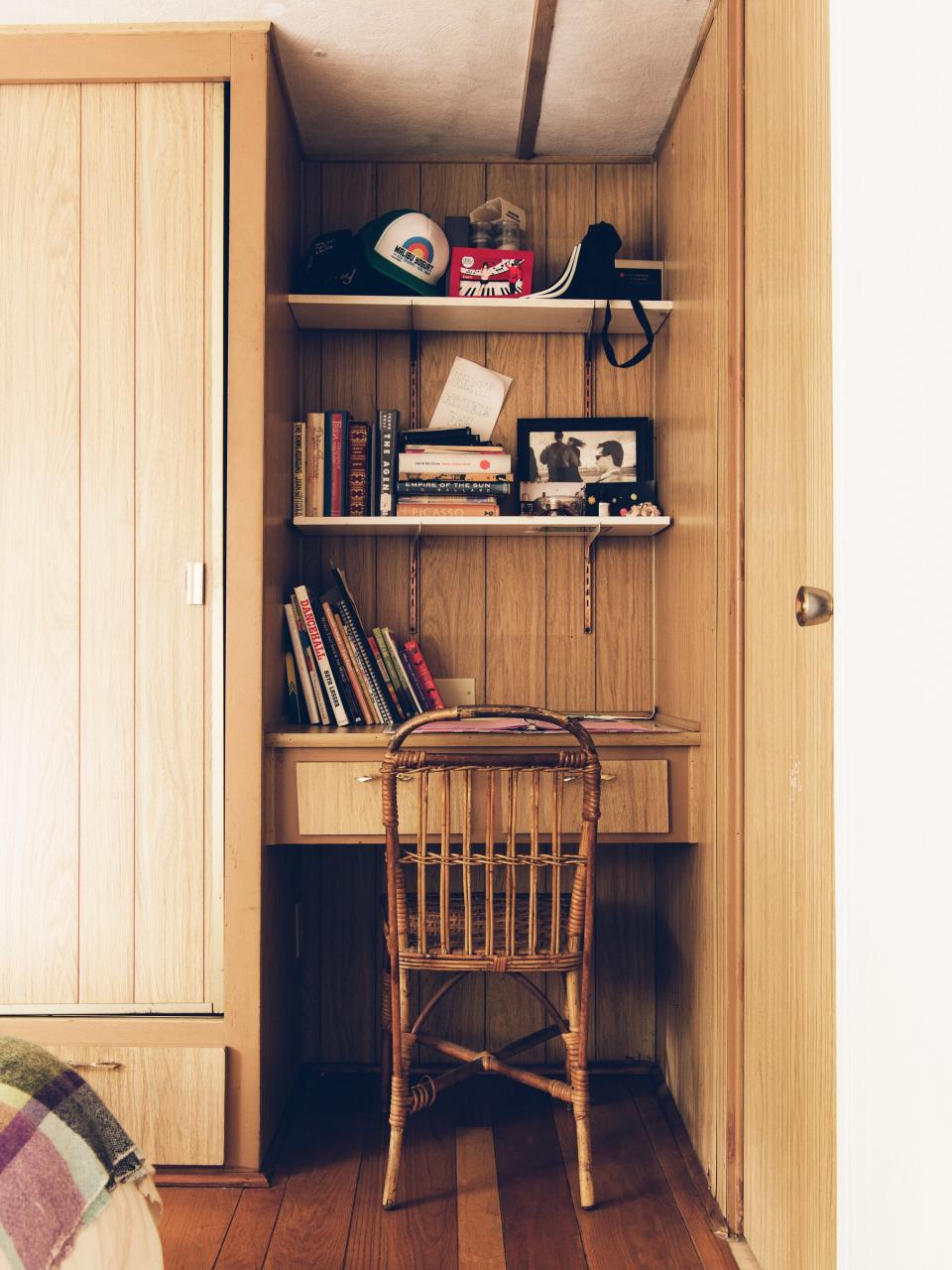 The wood paneling and built-in closet in the bedroom are both original.