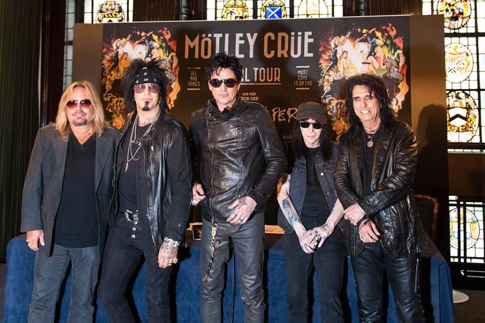 <p>Neil, Sixx, Lee, and Mars photographed alongside their opening act, Alice Cooper, in 2015 during their last European press conference for the band's final tour.</p>