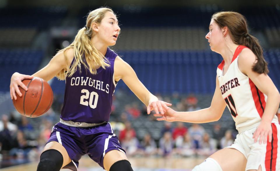 Mason High School's Tristin Keller is defended by a Muenster player during the UIL Class 2A girls basketball state semifinal at the Alamodome in San Antonio on Friday, March 6, 2020.