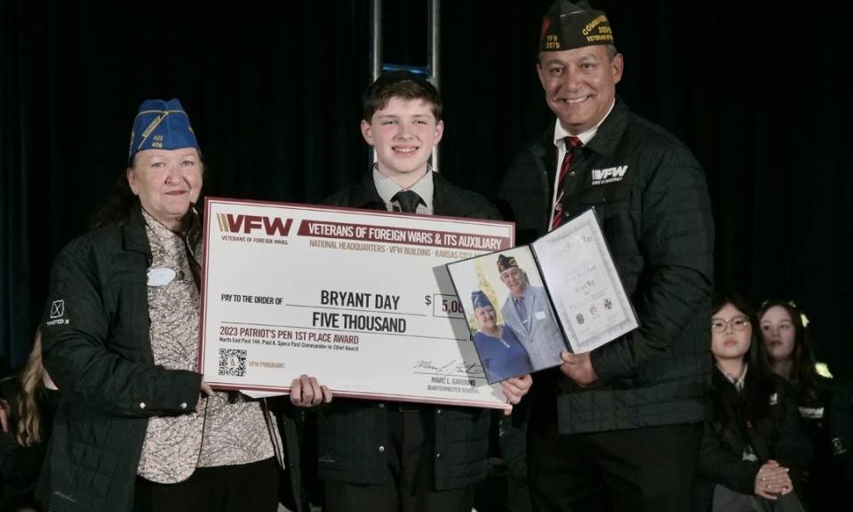 Bryant Day, an eighth grader at Temple Christian School in Mansfield, was selected as the national, first-place winner in the 2023-2024 Patriot's Pen essay contest. With him is VFW Auxiliary President Carla Martinez, at left, and VFW National Commander Duane Sarmiento.
