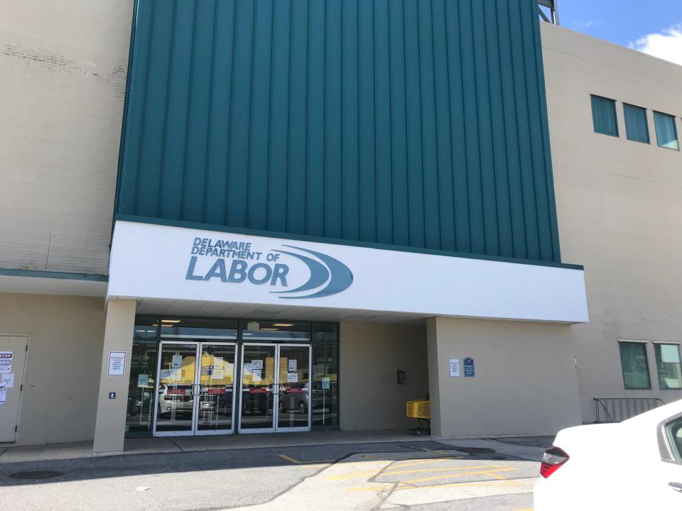 Several informational flyers were posted on the glass doors of the Delaware Department of Labor's Wilmington office building on Thursday, April 2.