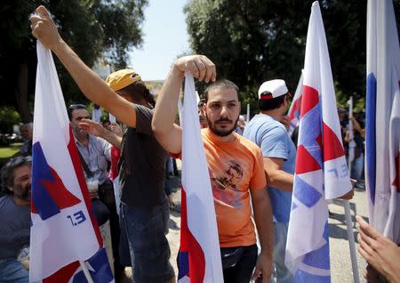 Supporters of the Greek Communist Party demonstrate in Athens, Greece, July 3, 2015. REUTERS/Jean-Paul Pelissier