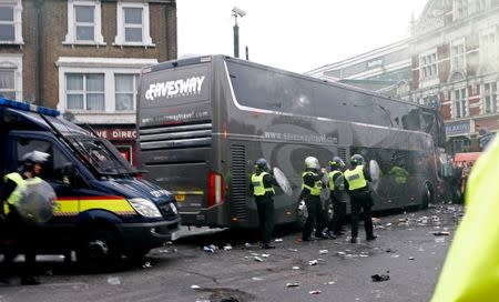 Britain Soccer Football - West Ham United v Manchester United - Barclays Premier League - Old Trafford - 10/5/16 General view as bottles are thrown at the Manchester United team bus before the match Reuters / Eddie Keogh Livepic