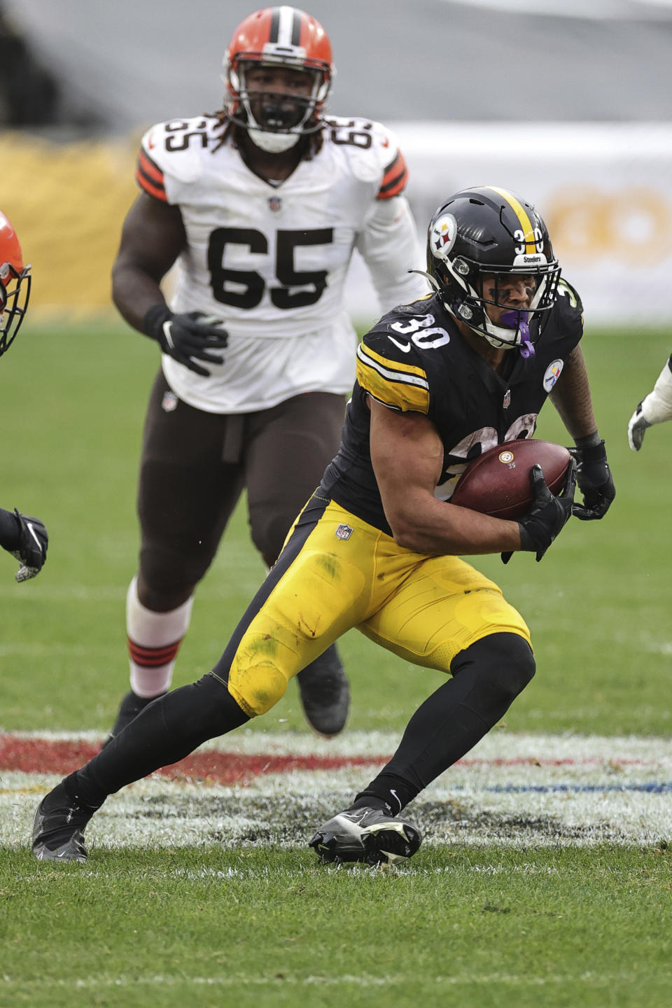Pittsburgh Steelers running back James Conner (30) carries the ball an NFL game against the Cleveland Browns, Sunday, Oct. 18, 2020, in Pittsburgh. The Steelers defeated the Browns 38-7. (Margaret Bowles via AP)