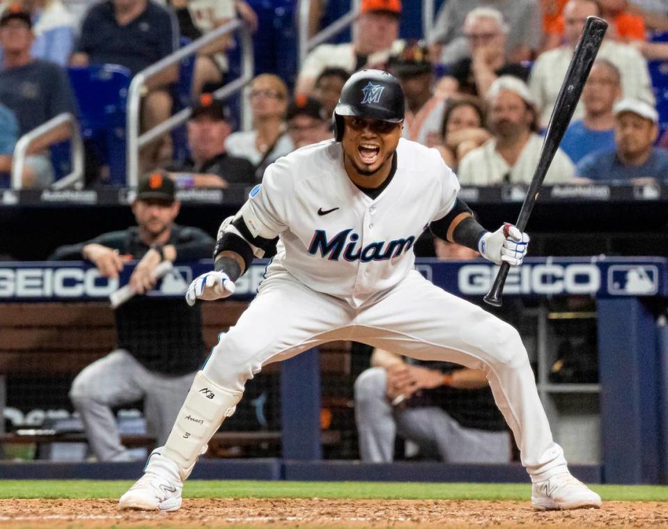 Miami Marlins second baseman Luis Arraez (3) reacts after stopping himself from swinging at a pitch against the San Francisco Giants in the eighth inning of an MLB game at loanDepot park on Monday, April 17, 2023, in Miami, Fla.