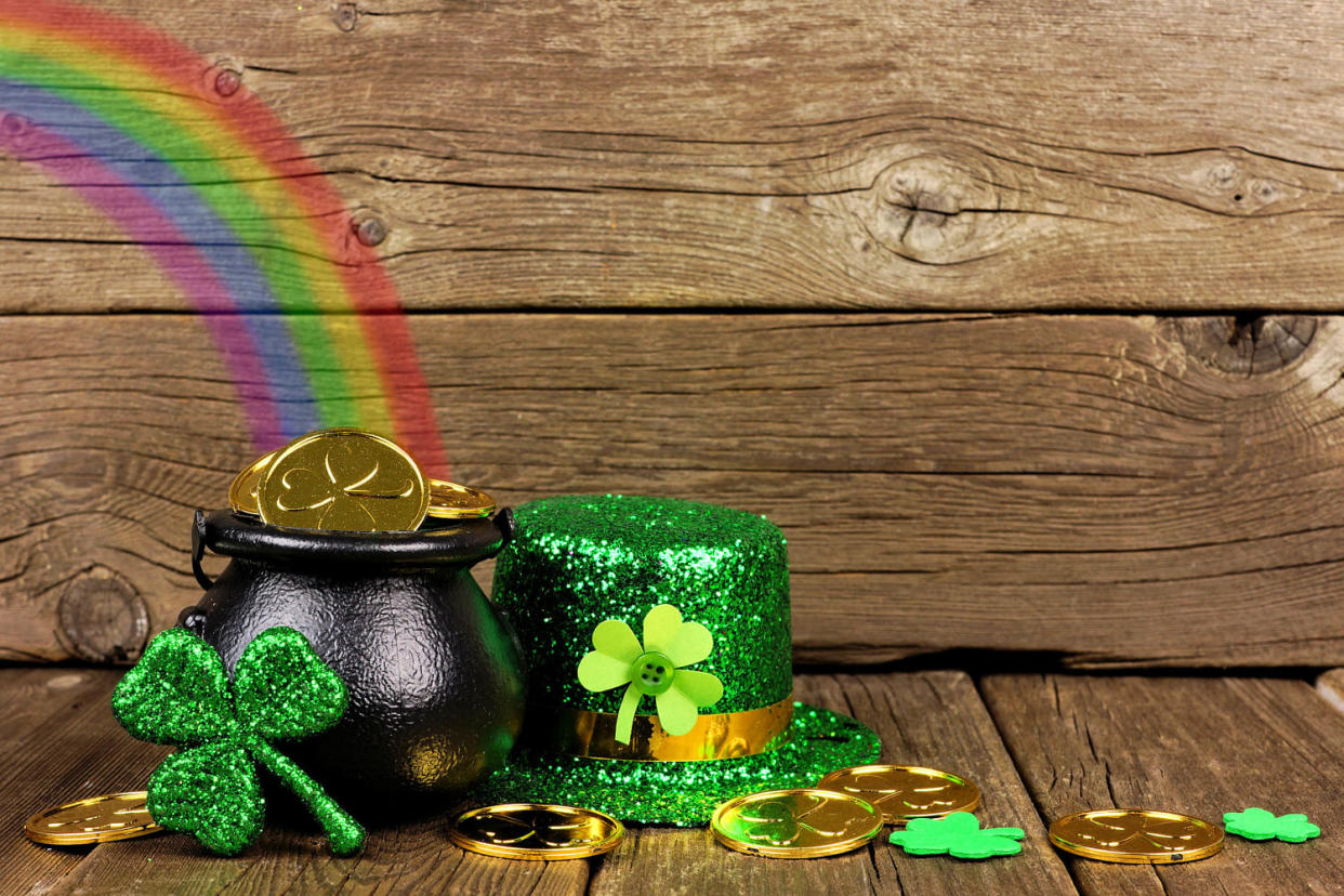St Patricks Day Pot of Gold with rainbow & decor against wood (Getty Images / iStockphoto)