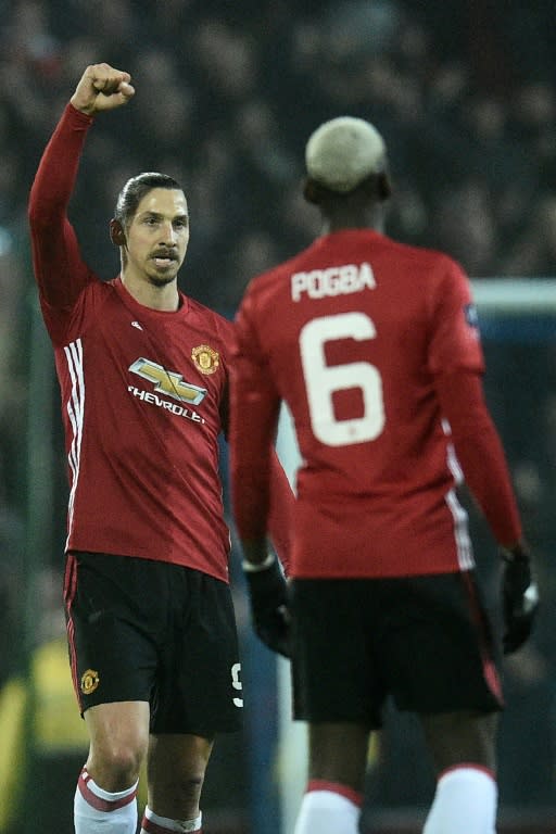 Manchester United's striker Zlatan Ibrahimovic (L) celebrates after scoring their second goal during an English FA Cup fifth round football match against Blackburn Rovers on February 19, 2017