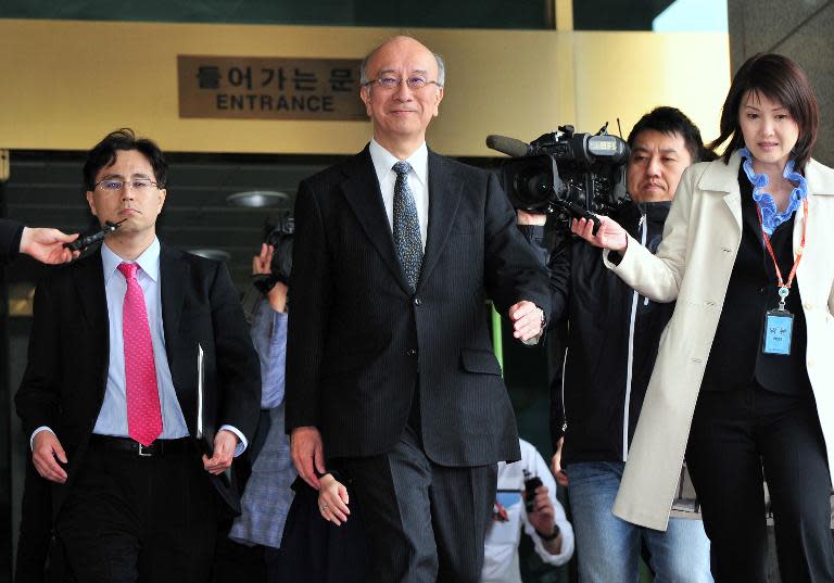 Japanese Ambassador to South Korea Koro Bessho (C) leaves after a meeting with South Korean Vice Foreign Minister Cho Tae-Yong at the Foreign Ministry in Seoul on April 4, 2014