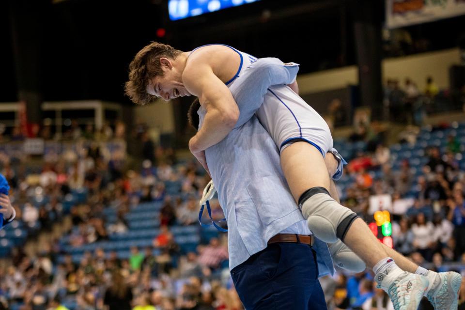 Washburn Rural's Brody Byrne celebrates winning a state title at State Wrestling on Saturday, Feb. 24, 2024.