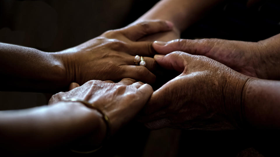 a closeup of people holding hands