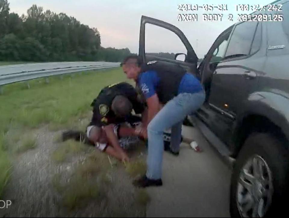 This image, which was attached to the federal lawsuit filed by Stephanie Bottom, shows the officers restraining Bottom on the ground. The image was taken from video footage captured by body worn cameras from the officers who pulled Bottom over on I-85 in 2019. Officer's body camera