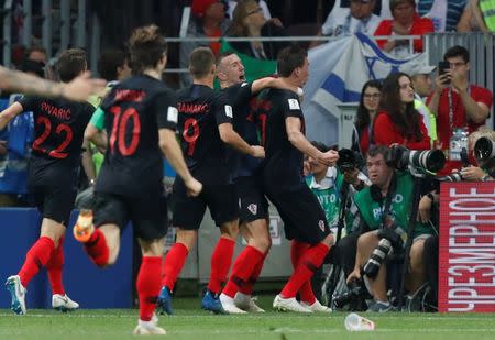 Soccer Football - World Cup - Semi Final - Croatia v England - Luzhniki Stadium, Moscow, Russia - July 11, 2018 Croatia's Mario Mandzukic celebrates scoring their second goal with teammates REUTERS/Maxim Shemetov