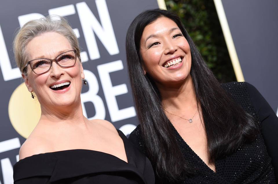 Meryl Streep and Ai-jen Poo, the head of the National Domestic Workers Alliance, arrive for the 75th Golden Globe Awards on January 7, 2018, in Beverly Hills, California.