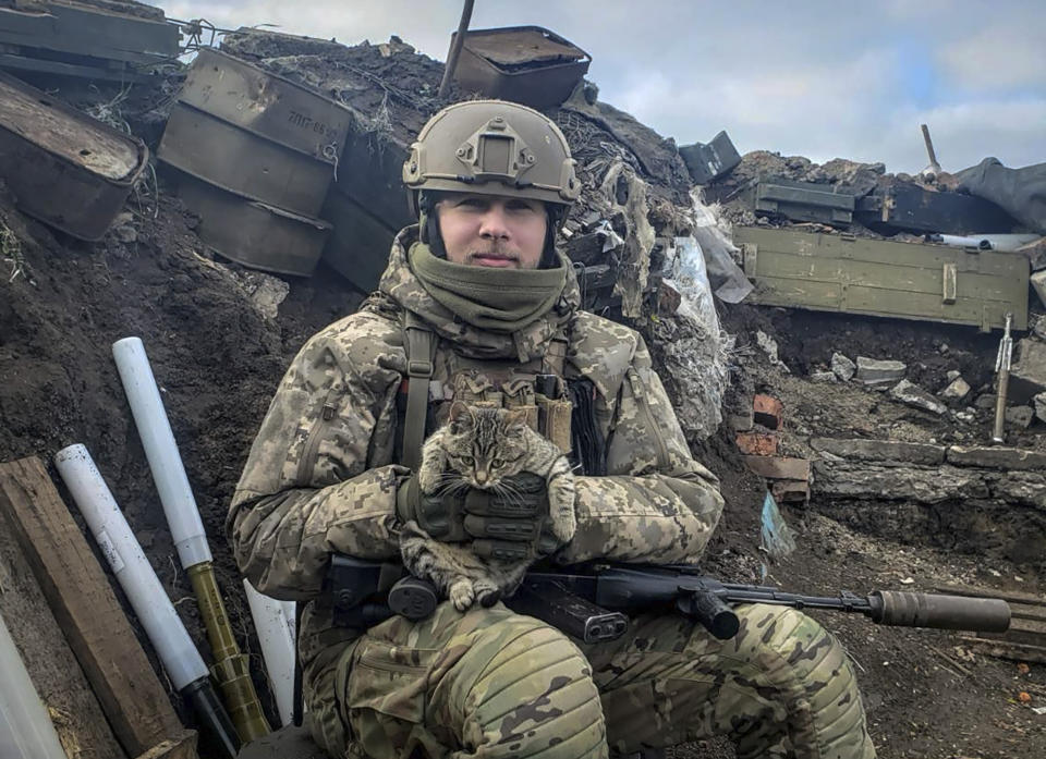 In this undated photo taken on the front-line, provided by Viktor Biliak, a Ukrainian infantryman with the 110th brigade, poses for a photo, in Avdiivka, Donetsk region, Ukraine. The loss of the city of Avdiivka in February 2024 marked the end of a long, exhausting defense for the Ukrainian military. One brigade had defended the same block of buildings for months without a break. Another unit had been in the city for nearly two years. (Viktor Biliak via AP)