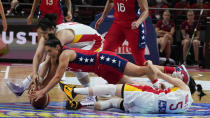 United States' Kelsey Plum dives to compete for the ball with China's Li Yueru during their gold medal game at the women's Basketball World Cup in Sydney, Australia, Saturday, Oct. 1, 2022. (AP Photo/Mark Baker)