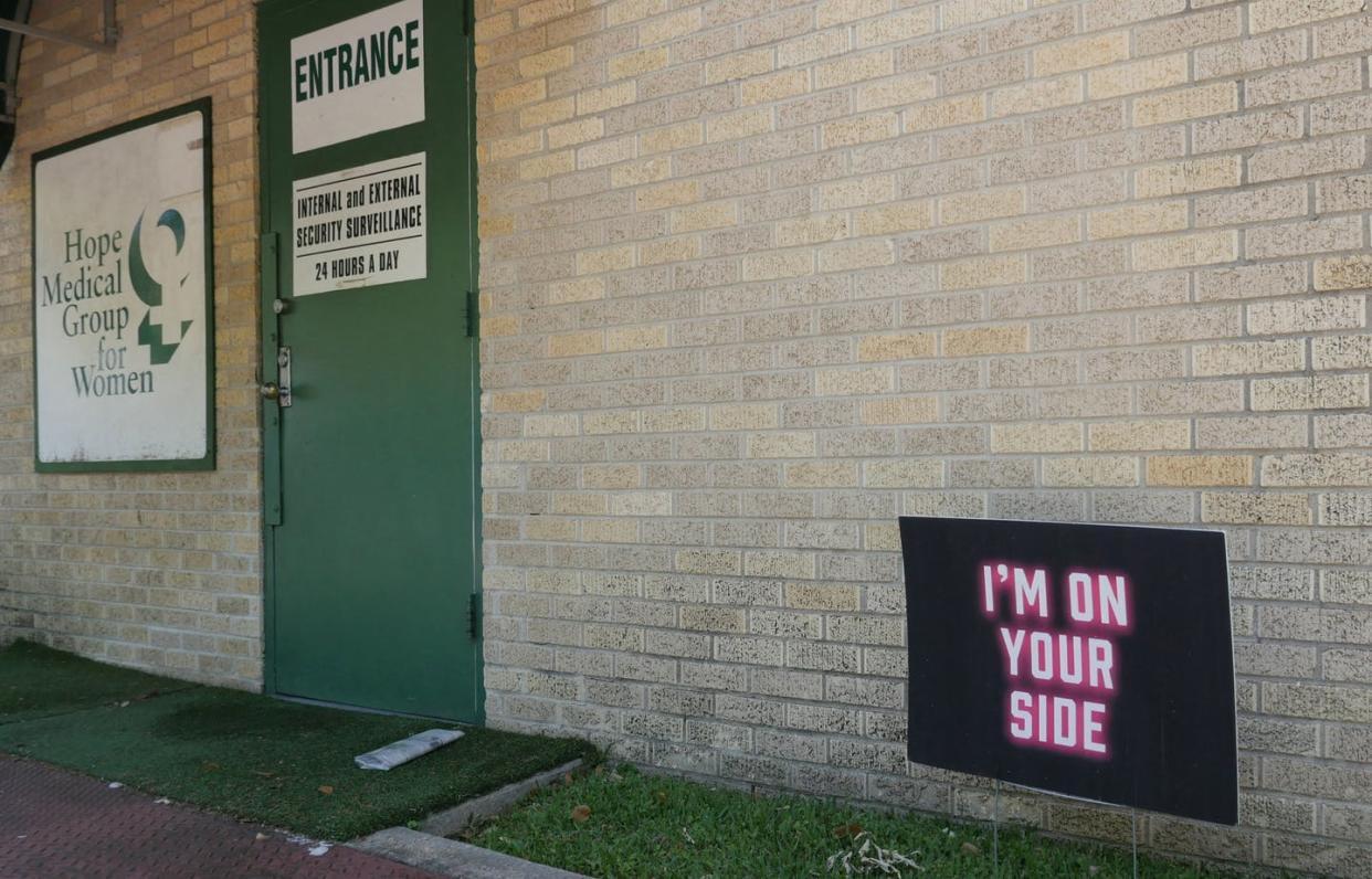 A sign reads 'I'm on your side' outside the Hope Medical Group for Women in Shreveport, La., in April 2022. <a href="https://media.gettyimages.com/photos/sign-reading-im-on-your-side-is-planted-on-the-lawn-in-front-of-the-picture-id1240239954?s=2048x2048" rel="nofollow noopener" target="_blank" data-ylk="slk:Francois Picard/AFP via Getty Images;elm:context_link;itc:0;sec:content-canvas" class="link ">Francois Picard/AFP via Getty Images</a>