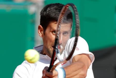 Tennis - Monte Carlo Masters - Monaco - 21/04/2017 - Novak Djokovic of Serbia plays a shot to David Goffin of Belgium. REUTERS/Eric Gaillard