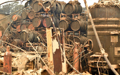 Burned wine barrels are seen at a destroyed Paradise Ridge Winery in Santa Rosa in California - Credit: AFP