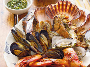 Barbecued shellfish platter with dipping sauces