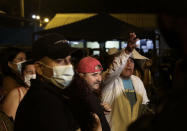 Relatives of inmates wait for news outside the Litoral penitentiary after a riot, in Guayaquil, Ecuador, Tuesday, Sept. 28, 2021. A police and military operation managed to regain control of the regional prison after five hours, according to a statement from Ecuador’s prison service, but reported at least 24 dead and 48 injured during the riot. (AP Photo/Angel DeJesus)