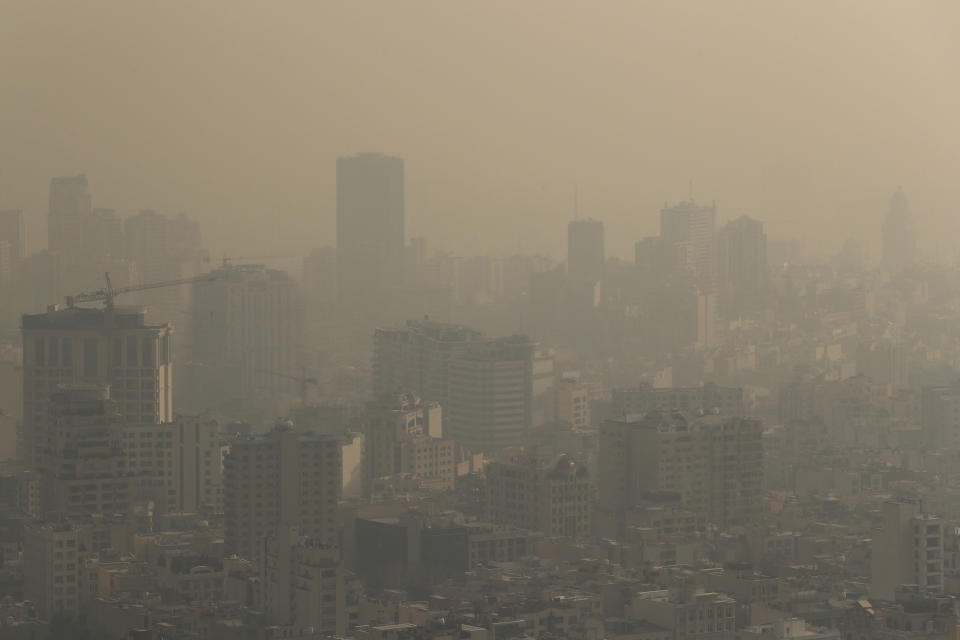 Thick smog blankets the skyline obscuring nearby mountains in Tehran, Iran, Monday, Dec. 23, 2019. Dangerously poor air quality forced Iran’s government on Monday to keep all schools closed in the capital, Tehran, and other cities. Schools were closed since Saturday, and will remain closed until Wednesday, the end of the week in Iran, according to the official IRNA news agency. Tehran’s air is among the most polluted in the world. (AP Photo/Ebrahim Noroozi)