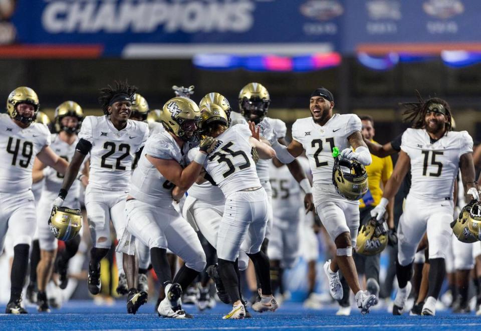 UCF kicker Colton Boomer is swarmed by teammates after kicking the winning field goal to defeat Boise State 18-16, Saturday, Sept. 9, 2023, in Boise.