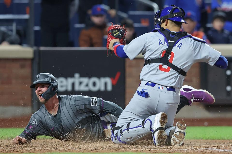 New York Mets first baseman Pete Alonso (20) is tagged out at home to end the game by Chicago Cubs catcher Miguel Amaya (9) while trying to score on a fly ball during the ninth inning on May 1, 2024, at Citi Field. The play was upheld after a video review.
