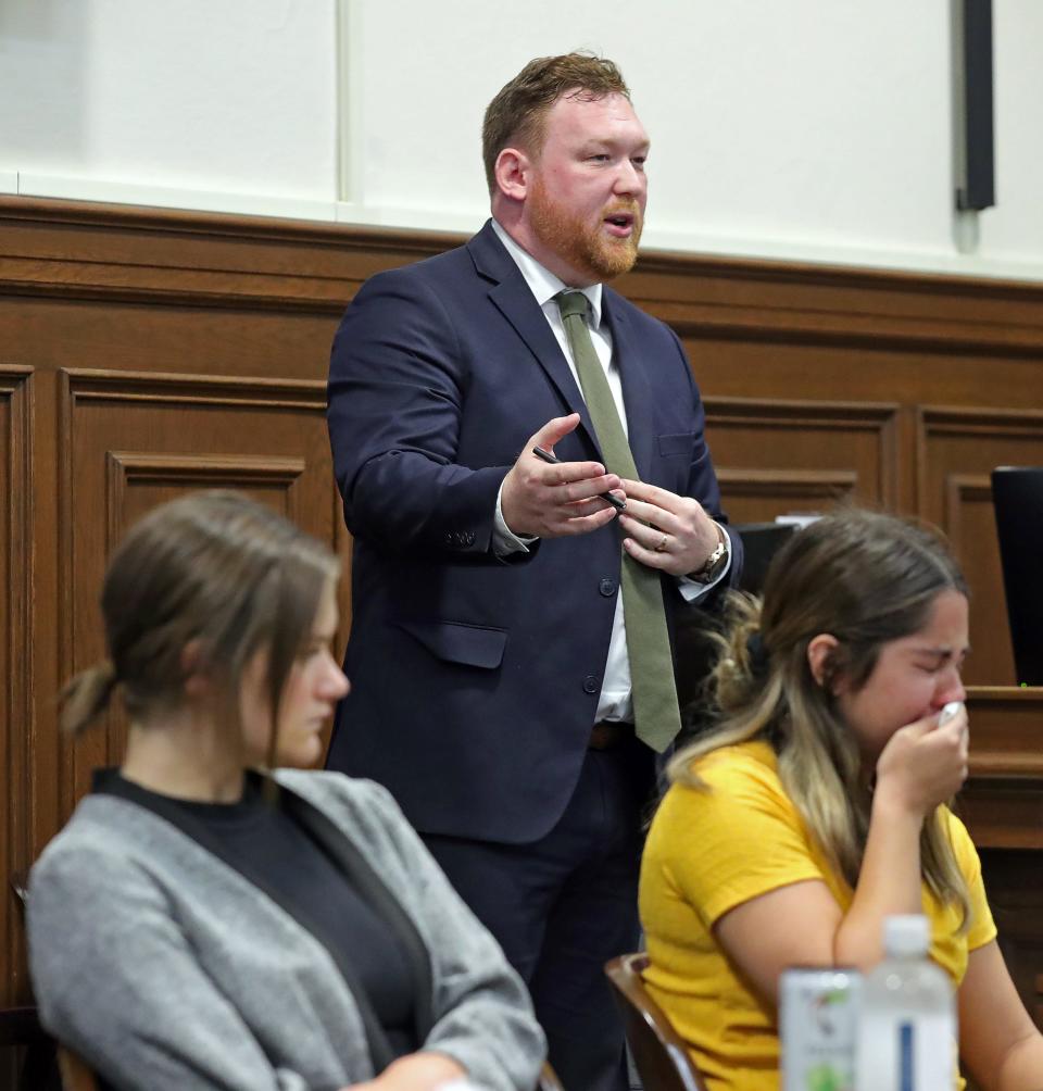 Assistant Summit County Prosecutor Joe McAleese gives his opening statement as defendant Sydney Powell weeps at the start of her murder trial in Judge Kelly McLaughlin's courtroom.