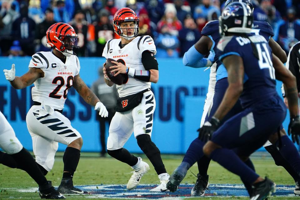 Cincinnati Bengals quarterback Joe Burrow (9) looks downfield in the second quarter during an NFL divisional playoff football game against the Tennessee Titans, Saturday, Jan. 22, 2022, at Nissan Stadium in Nashville.
