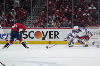 Washington Capitals center Hendrix Lapierre (29) prepares to shoot, scoring a goal, as New York Rangers' Jarred Tinordi (5) defends during the second period of an NHL hockey game Wednesday, Oct. 13, 2021, in Washington. (AP Photo/Alex Brandon)