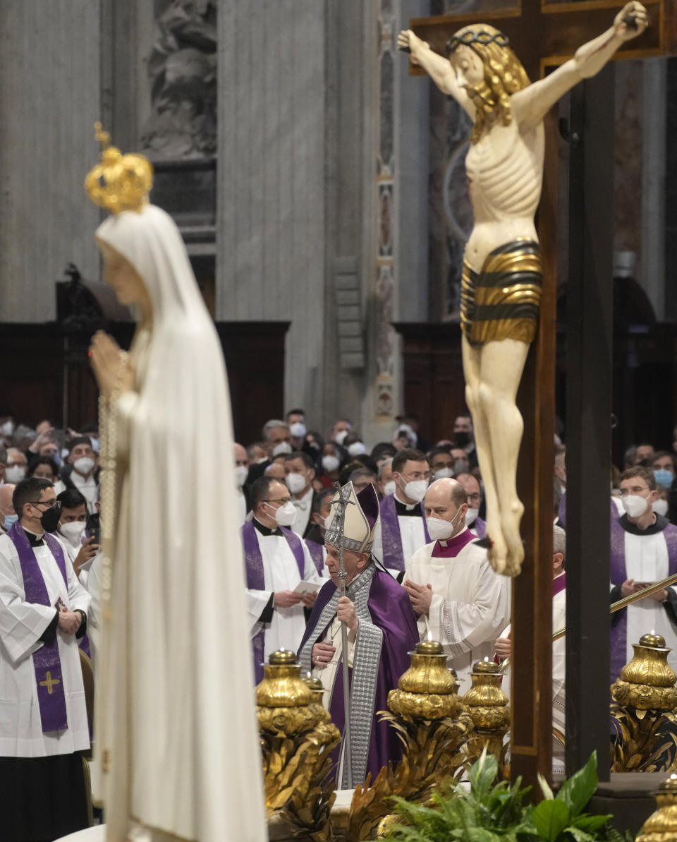 Pope Francis presides over a special prayer in St. Peter's Basilica at the Vatican, Friday, March 25, 2022. Francis is presiding over a special prayer for Ukraine that harks back to a century-old apocalyptic prophesy about peace and Russia that was sparked by purported visions of the Virgin Mary to three peasant children in Fatima, Portugal in 1917. (AP Photo/Gregorio Borgia)