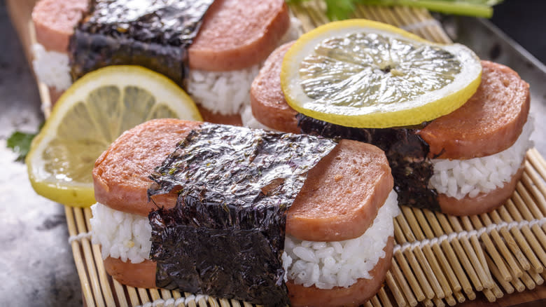 spam musubi on bamboo mat