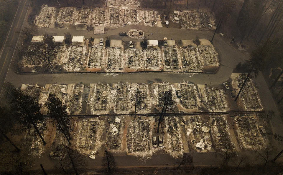 FILE - Residences leveled by a wildfire in Paradise, Calif., are seen on Nov. 15, 2018. State Farm will discontinue coverage for 72,000 houses and apartments in California starting summer 2024, the insurance giant said. The Illinois-based company, California's largest insurer, cited soaring costs, the increasing risk of catastrophes like wildfires and outdated regulations as reasons it won’t renew the policies on 30,000 houses and 42,000 apartments, the Bay Area News Group reported Thursday, March 21, 2024. (AP Photo/Noah Berger, File)