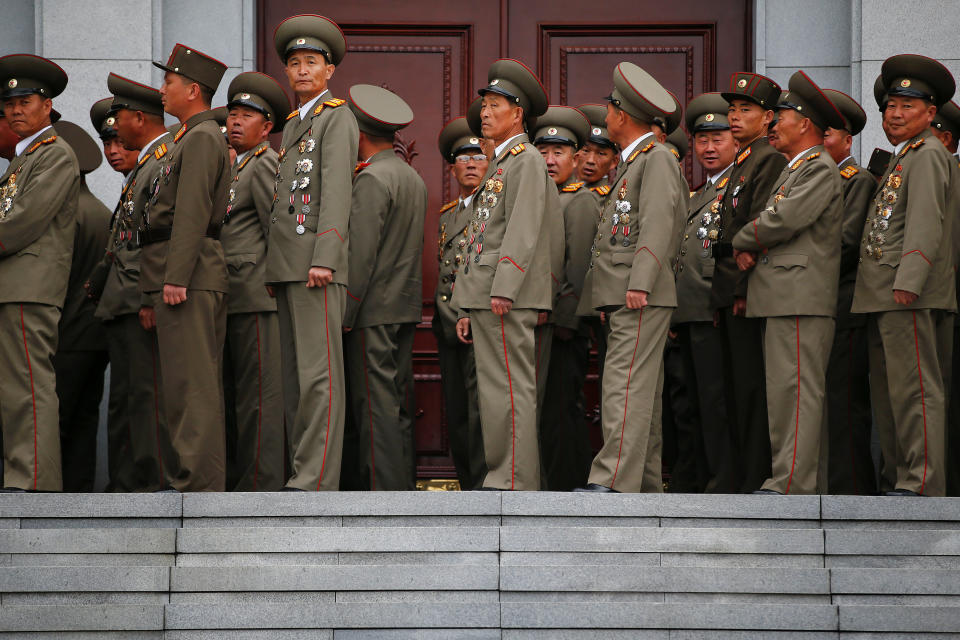 Military officers visit the birthplace of North Korean founder Kim Il Sung, a day before the 105th anniversary of his birth, in Mangyongdae, just outside Pyongyang, April 14, 2017.