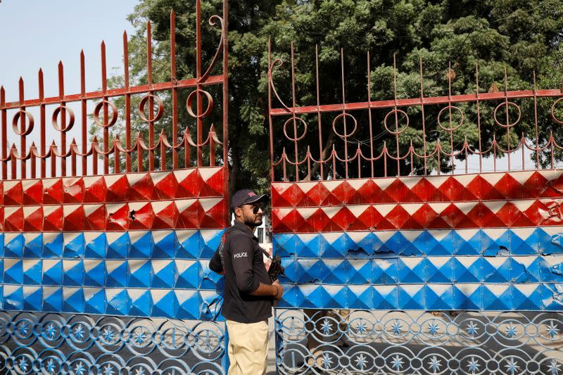 A police officer stands guard at the entrance of the Central Prison in Karachi